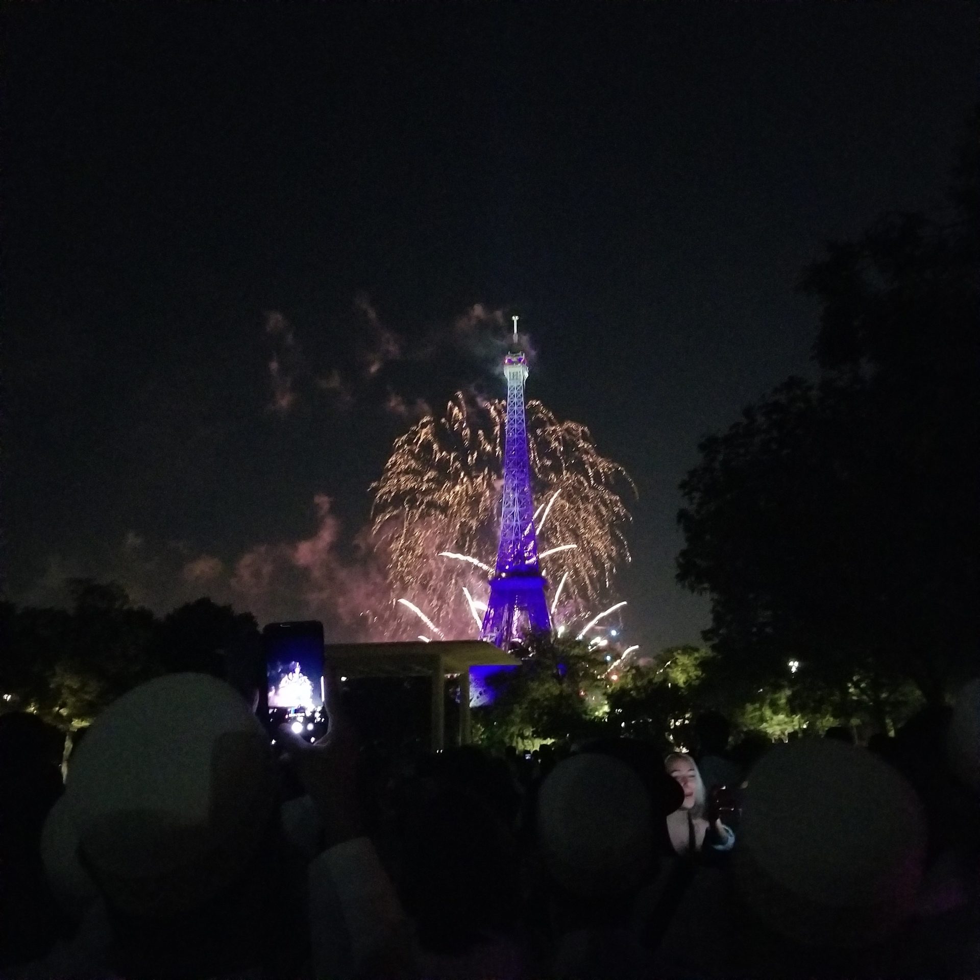 Eiffel tower with fireworks behind