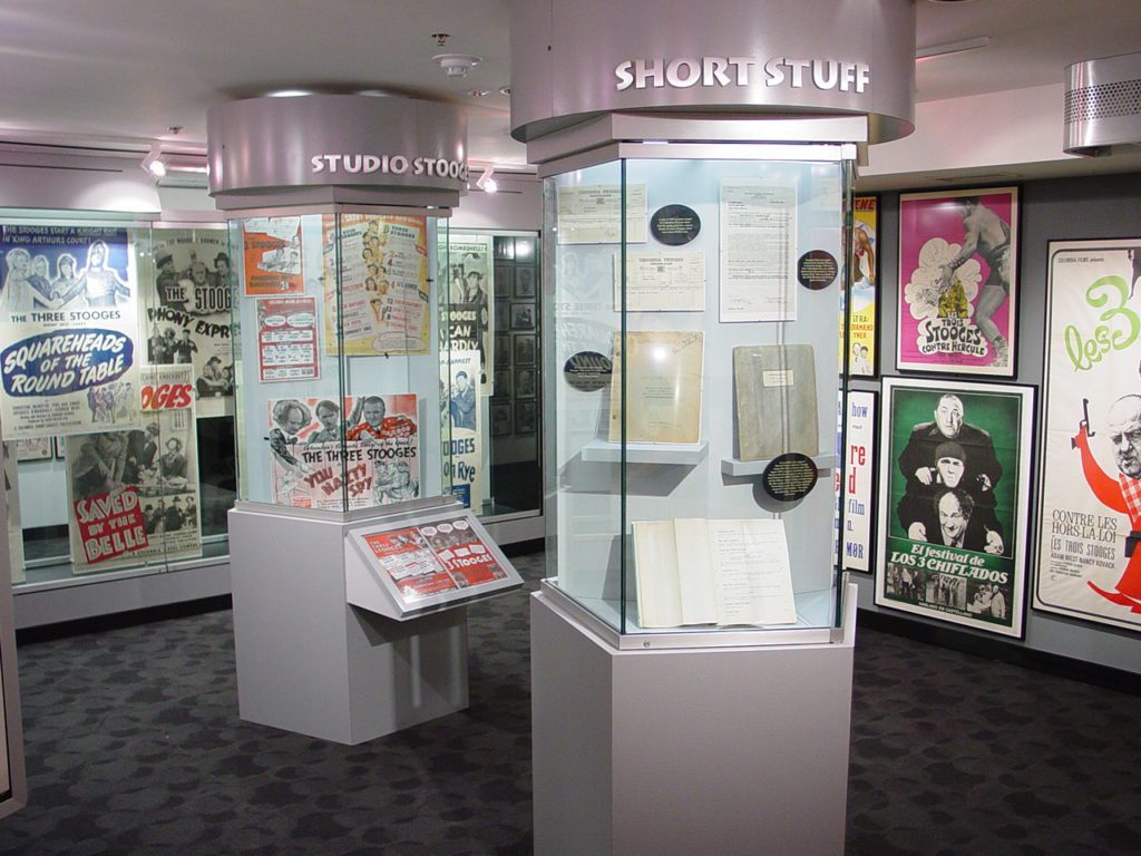 1st floor Poster Gallery at the Stoogeum and wax images of the Three Stooges.