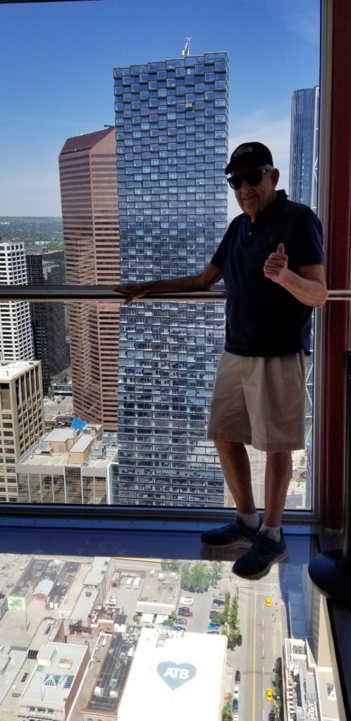 Steve on the glass floor of the Calgary Tower which presents quite a view.