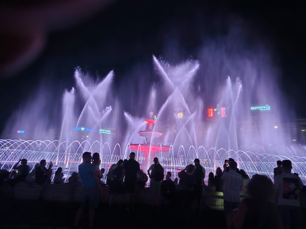 Dynamic nighttime fountain show at Piata Unririi, Bucharest Romania